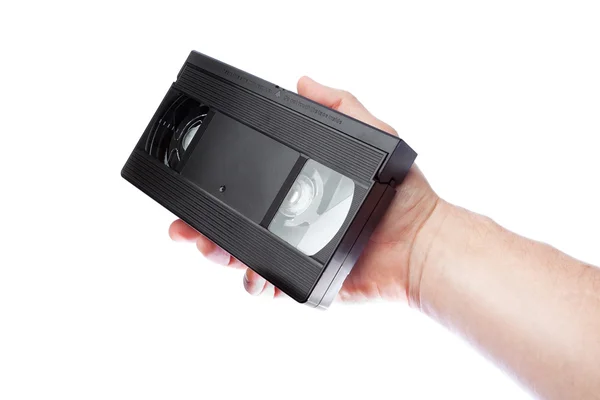 In de hand van een man oude videoband formaat vhs. — Stockfoto