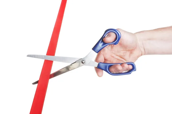 Man's hand cut red tape scissors. Business concept. — Stock Photo, Image