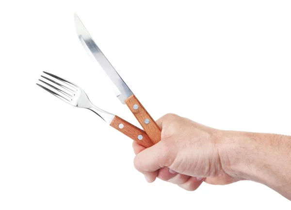 Cubiertos de un restaurante en mano de un hombre. sobre un fondo blanco. — Foto de Stock