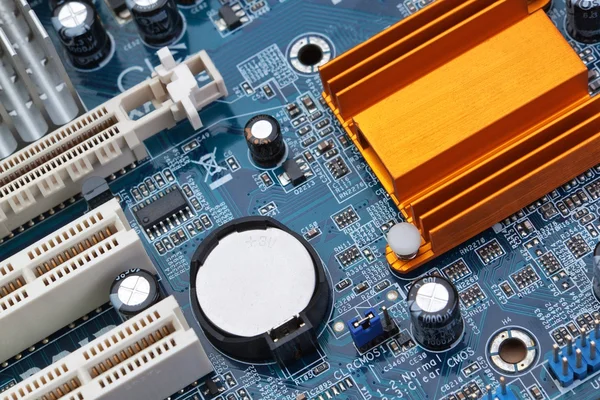 Part of the motherboard of the computer with battery and radiato — Stock Photo, Image