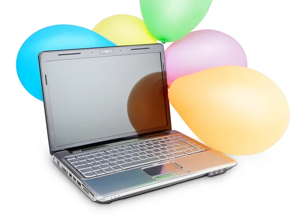 Смешные фотографии карнавал резиновые шарики на современный ноутбук. Для бизнес-аналитики — стоковое фото