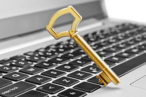 Golden key symbol of security in Internet and computer science. — Stock Photo, Image