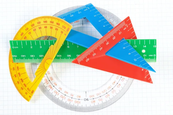 A set of colored triangles and lines protractors for drawing. On — Stock Photo, Image