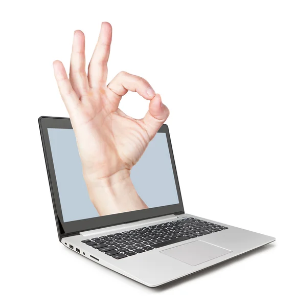 All perfectly, the hand pops out of the laptop. Concept idea. — Stock Photo, Image