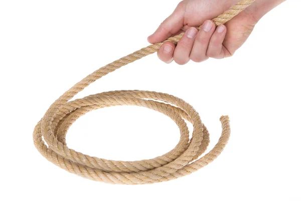 A roll of thick strong rope and the end of a man's hand. Close-up. — Stockfoto