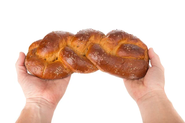 Man holding bread in his hands as a welcome. Close up on white background. — Stock Photo, Image