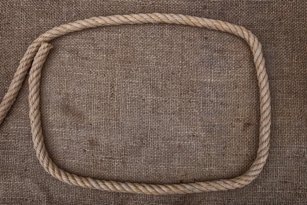 Frame of rope on sackcloth. For text. — Stock Photo, Image