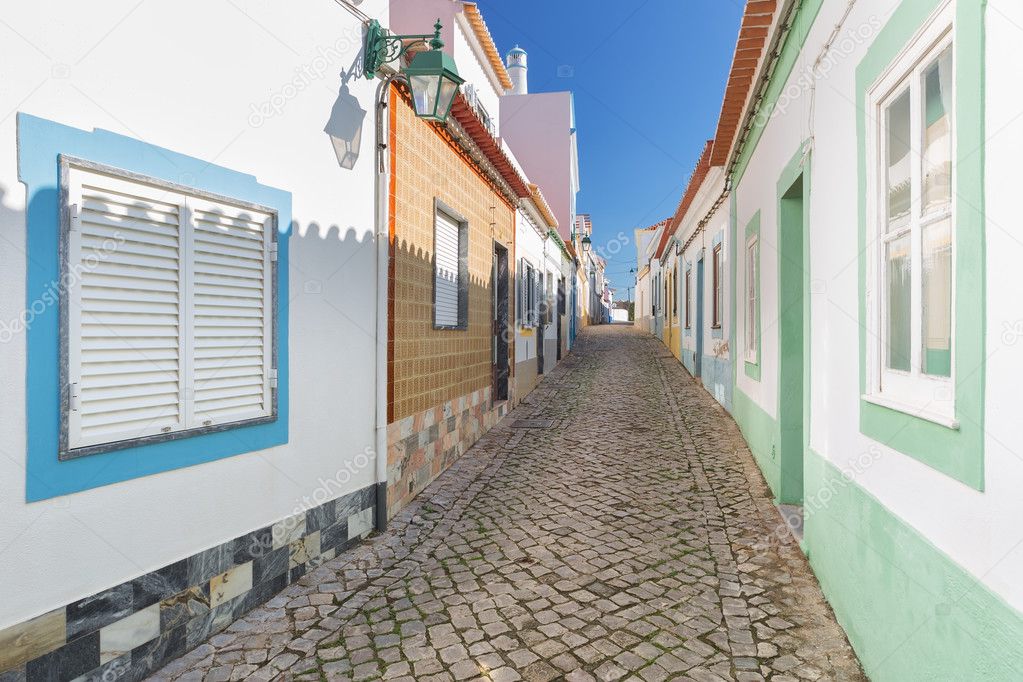 Traditional old Portuguese street with stone lane. Ferragudo.