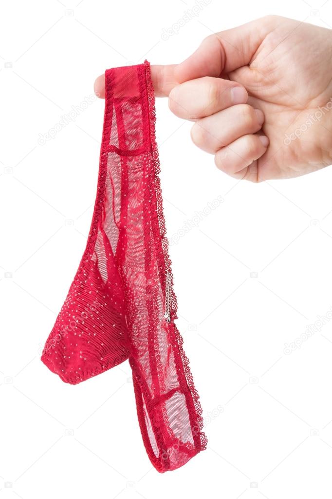 Man's hand holding a sexy female panties. On a white background.