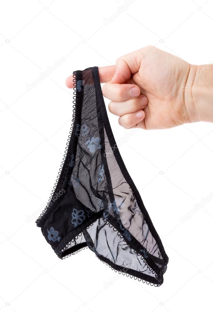 Women's panties on his finger at the man. On a white background