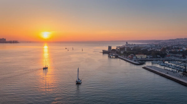 Aerial view of the Portuguese Historical Folk Patrimony, Belem Tower, on the Tagus River. During sunset.