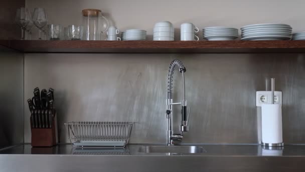 Stand with modern kitchen utensils in inox metal style. Hotel hostel kitchen. — Stockvideo