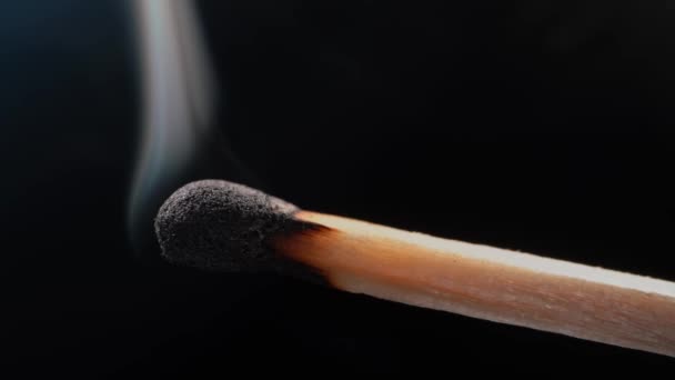 Smoke in slow motion matches in macro mode. Close-up on a black background. — Vídeos de Stock