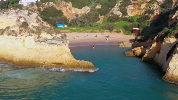 Aerial view of beautiful Portuguese beaches with rocky sandy shores and pure sand for tourists recreation in the Algarve in the south. — Stock Video