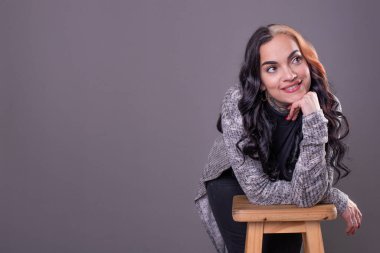Beautiful woman with hands on face. Studio shot. Copy Space