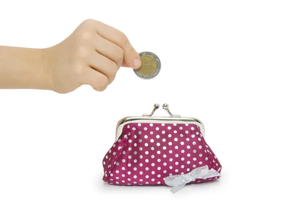 Hand throwing coin in purse on white background — Stock Photo, Image