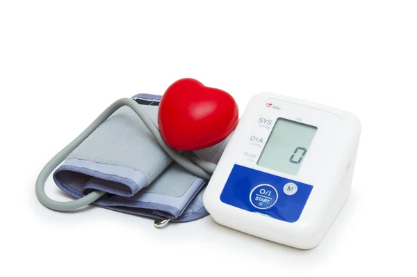 Digital blood pressure meter with love heart symbol on white background — Stock Photo, Image