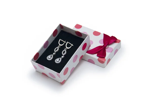 Silver earrings in a box on white background — Stock Photo, Image