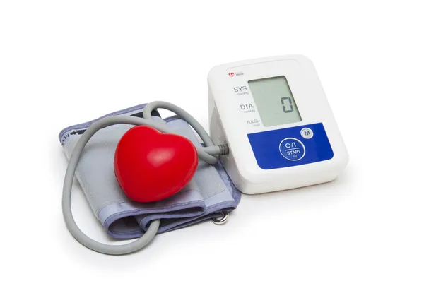 Digital blood pressure meter with love heart symbol on white background — Stock Photo, Image