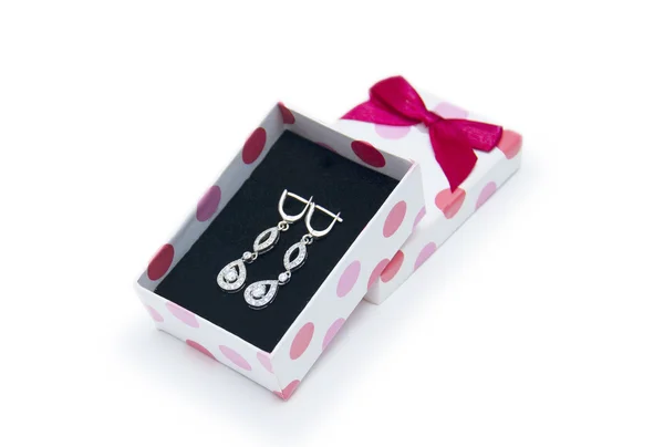 Silver earrings in a box on white background — Stock Photo, Image