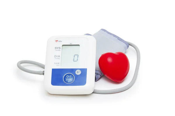 Digital blood pressure meter with love heart symbol on white background — Stock Photo, Image