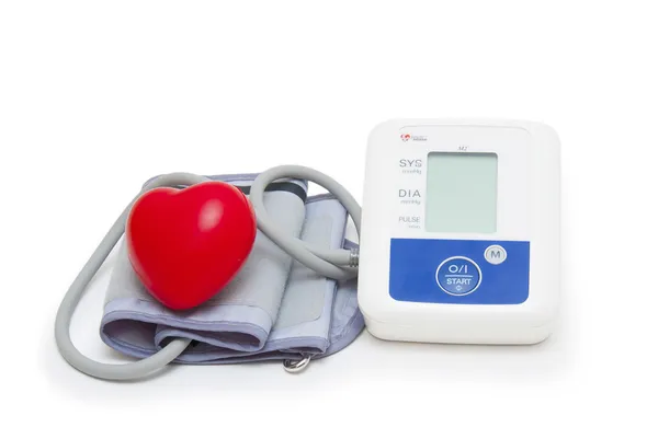 Digital blood pressure meter with love heart symbol on white background — Stock Photo, Image