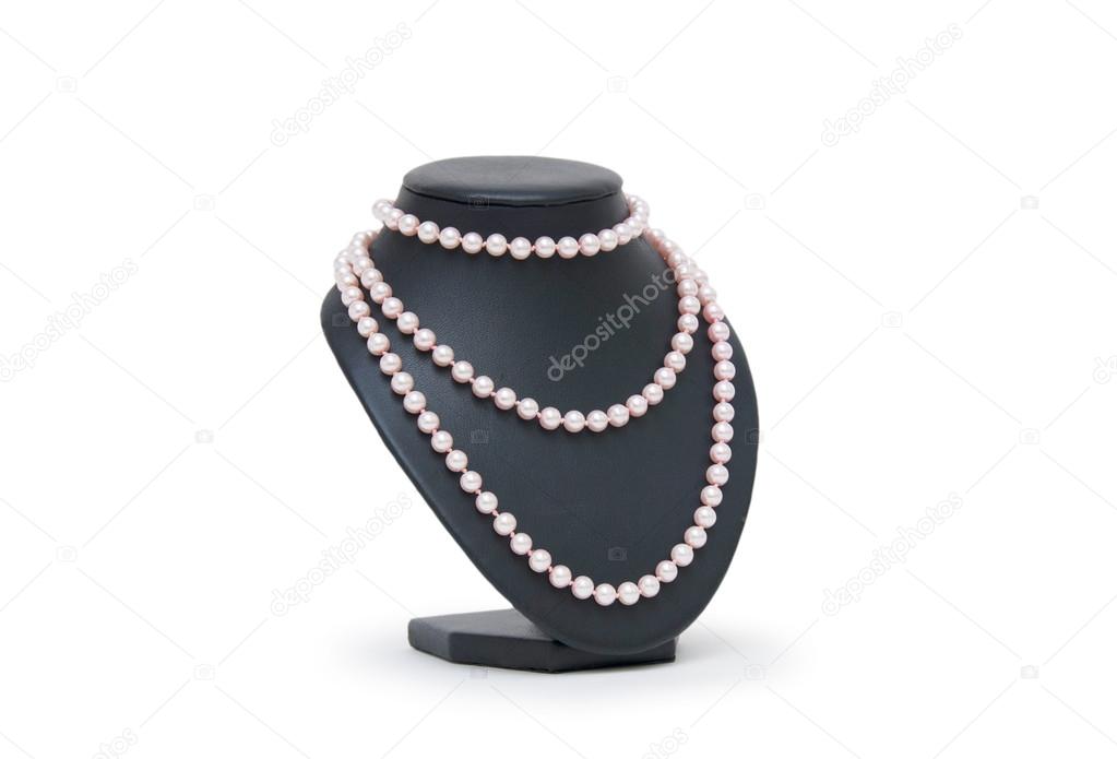 Pearl necklace on black mannequin isolated