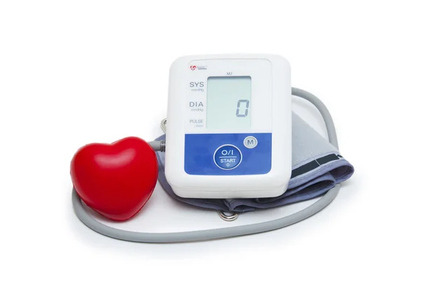 Digital blood pressure meter with love heart symbol on white background — Stock Photo, Image