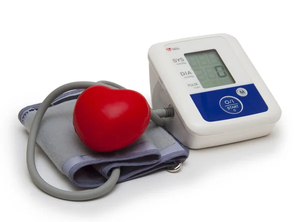 Digital blood pressure meter with love heart symbol on white background — Stock Photo, Image