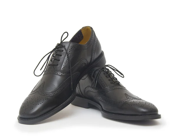 Les chaussures de l'homme noir isolé sur fond blanc . — Photo