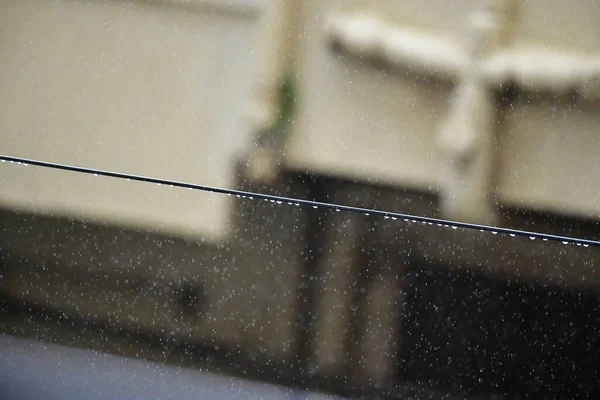 Rain Water droplets on a electric cable or wire
