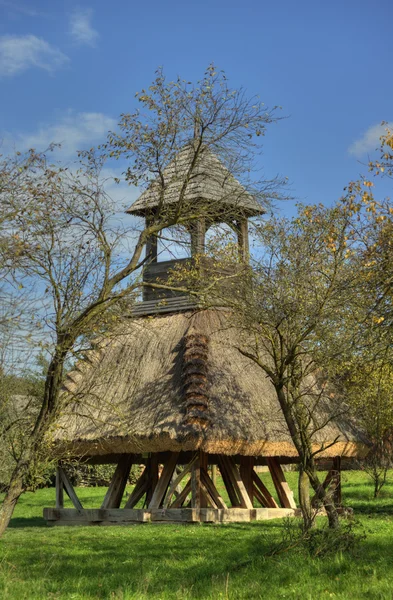 Wooden bell tower wit thatch — Stock Photo, Image