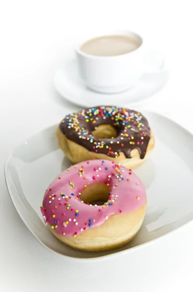 Donuts and coffee cup — Stock Photo, Image