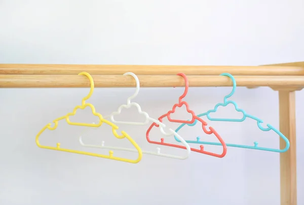 Colored Plastic Clothes Hangers Wooden Clothes Line White Background — Stock Photo, Image