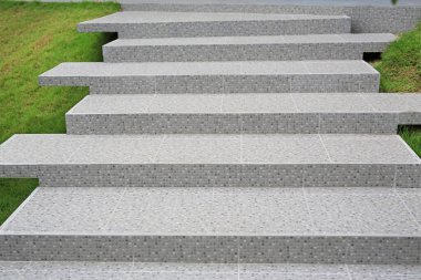 Stairs are decorated with pebble tiles.