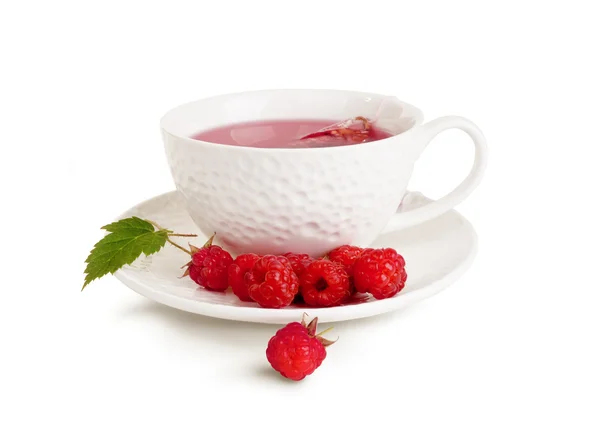White mug of tea and raspberry Stock Photo