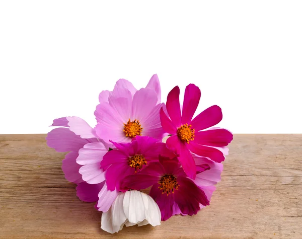 Flowers on a wooden table — Stock Photo, Image