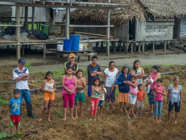 Amazon River, Peru -Dec 11, 2017: People looking on the boat in the small Peruvian village on bank of Amazon river.