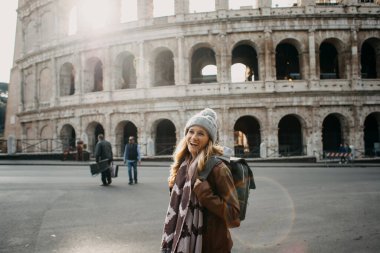 Young blonde woman exploring the streets of Europe