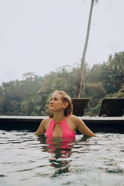 Young Woman Relaxing Pool Edge Bali Stockbild