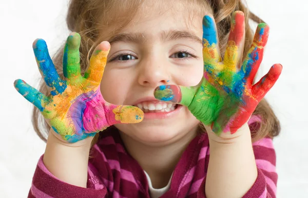 Preschool girl with painted hands — Stock Photo, Image