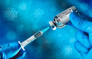 Vaccination concept for new variants of covid-19. Doctor drawing up Covid-19 vaccine filling syringe from vial with label Vaccine on background of an illustration of coronavirus under microscope