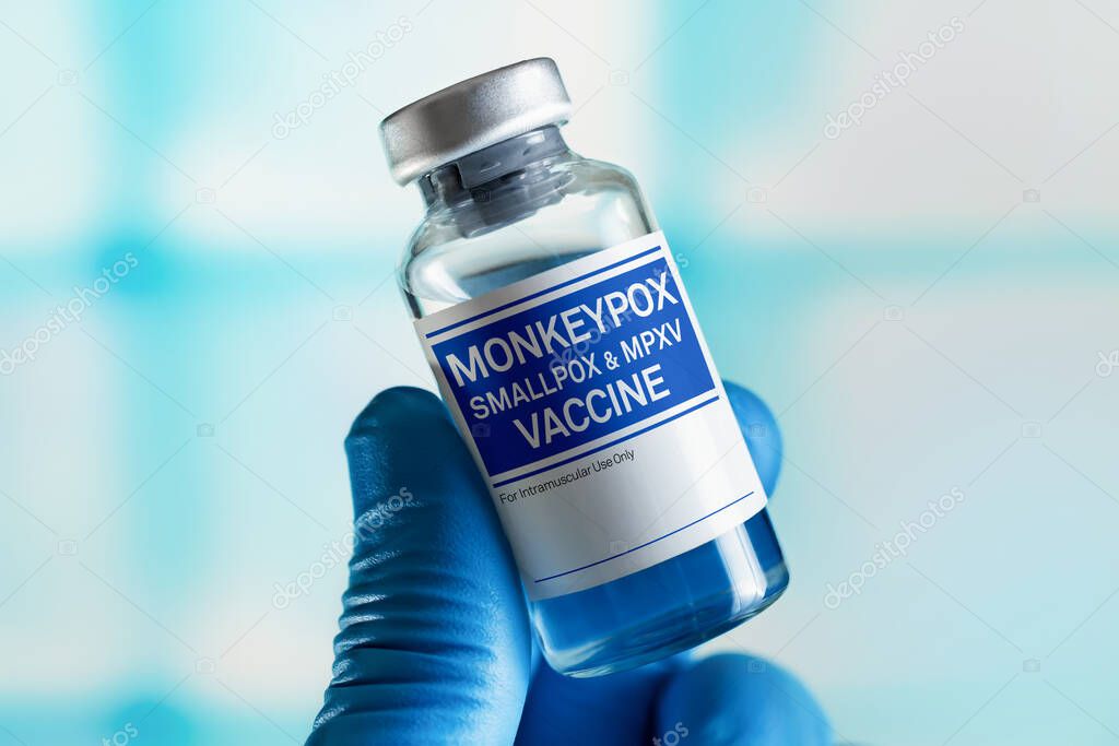 Vaccination for booster shot for Smallpox and Monkeypox (MPXV). Doctor with vial of the doses vaccine for Monkeypox (MPXV) disease
