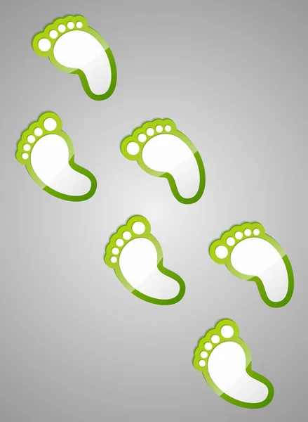 Green footprints on grey background. — Stock Vector
