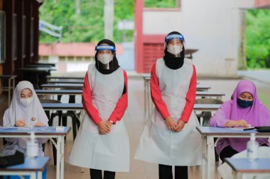 Muadzam Shah, Malaysia - April 7th, 2022 : New students made a quick Covid-19 test by placing saliva and fluid buffer observations during student enrolment day.