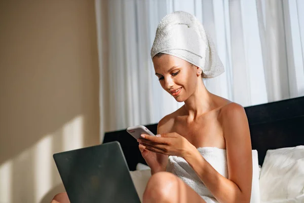 Pretty Woman Wrapped Bath Towel Lying Bed Laptop Knees Holding Stock Photo