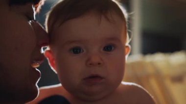 Authentic Close Up Footage of a Mother Soothing and Holding Hand of a Newborn Baby in Child Crib. Caucasian Neonate Toddler at Home in Kids Bedroom. Concept of Childhood, New Life and Parenthood