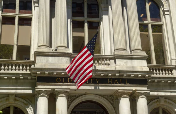 American flag on the Old City Hall building in Boston, Massachusetts, USA