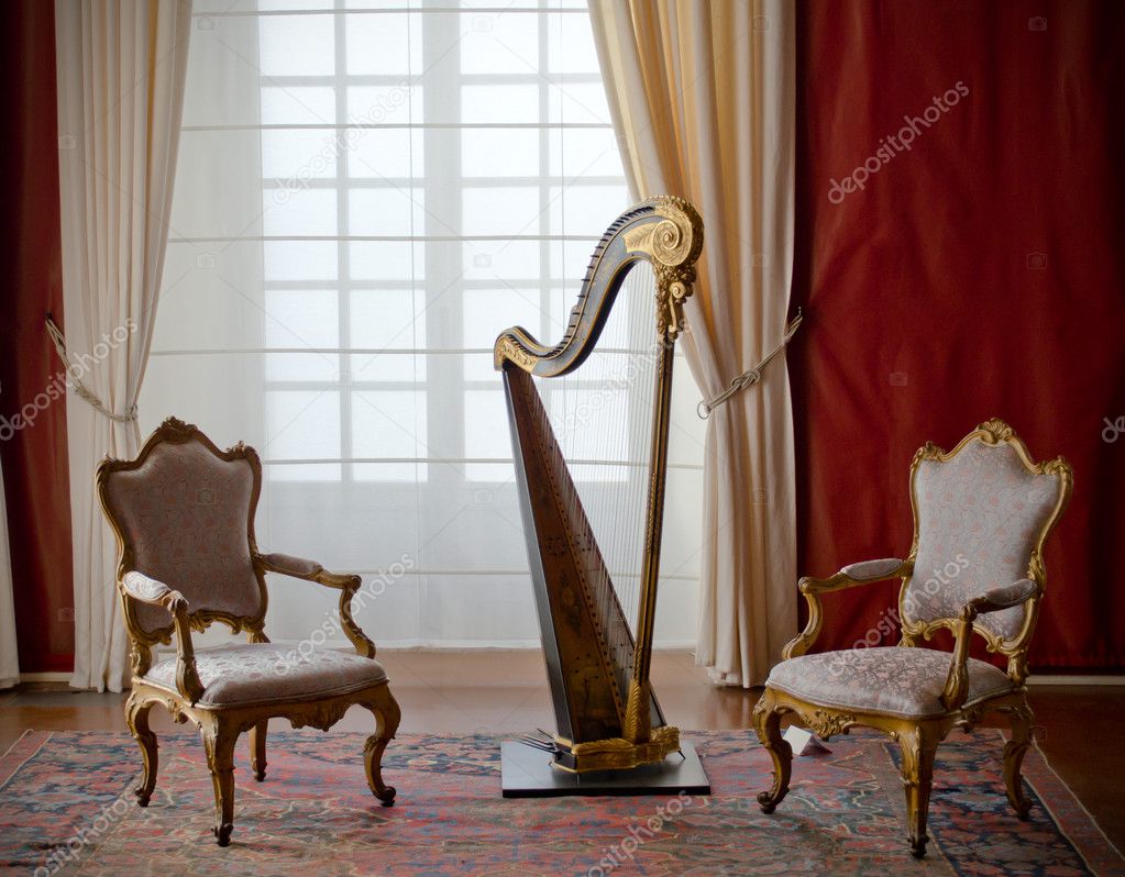 Classic elegant chairs and harp
