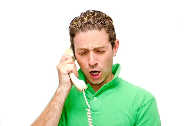 Frustrated young man on the phone — Stock Photo, Image